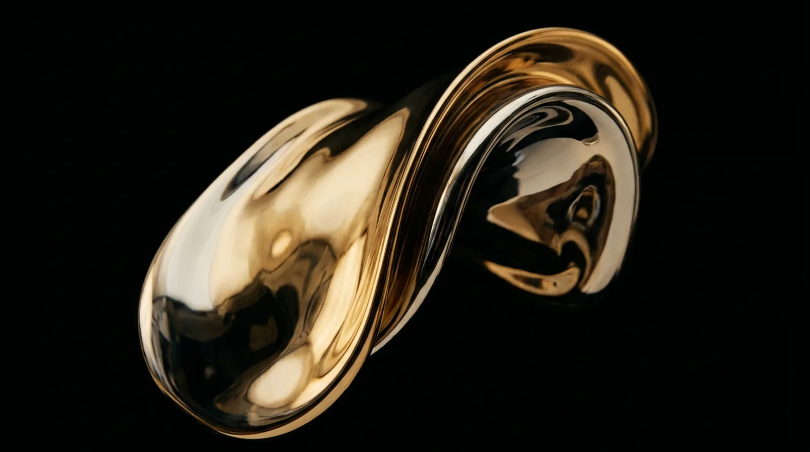 Molten gold folding over itself against black
